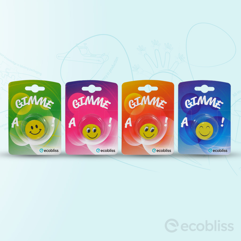 Colorful Ecobliss cold‑seal blister packs with smiley products for retail packaging.